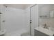 Bathroom with a gray vanity and a walk-in shower at 9195 Bay Dr, Spring Hill, FL 34608