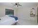 A light and airy bedroom that offers direct access to the pool area, providing a seamless indoor-outdoor living experience at 9195 Bay Dr, Spring Hill, FL 34608