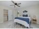 Comfortable bedroom with bathroom access, complemented by stylish decor, natural light, and contemporary furnishings, creating a soothing retreat at 9195 Bay Dr, Spring Hill, FL 34608