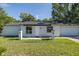 Attractive single-story home featuring an attached one car garage and manicured front lawn at 9195 Bay Dr, Spring Hill, FL 34608