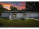 Exterior elevation of the home with a two car garage at 9195 Bay Dr, Spring Hill, FL 34608