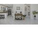 Open hallway connecting the kitchen with living area, featuring modern accents at 9195 Bay Dr, Spring Hill, FL 34608