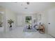 Comfortable living room with tile flooring, ceiling fan, sofa, and natural light at 9195 Bay Dr, Spring Hill, FL 34608