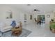 Open living space with access to a dining area and view of the outdoor pool at 9195 Bay Dr, Spring Hill, FL 34608