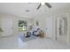 Inviting living room with sofa, tiled floors and filled with natural light at 9195 Bay Dr, Spring Hill, FL 34608
