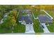 Aerial shot showing a modern house, a long patterned driveway, and well-manicured front yard landscaping at 9201 Nightingale Rd, Weeki Wachee, FL 34613