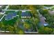 An aerial view of the backyard featuring a pristine white fence, offering privacy and clear property lines at 9201 Nightingale Rd, Weeki Wachee, FL 34613