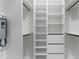 Custom walk-in closet with built-in shelving and drawers for storage at 9201 Nightingale Rd, Weeki Wachee, FL 34613
