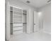 Bright closet with adjustable shelving and drawers next to a white door at 9201 Nightingale Rd, Weeki Wachee, FL 34613