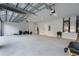 Large open garage with high ceilings and plenty of storage space at 9201 Nightingale Rd, Weeki Wachee, FL 34613