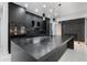 Modern kitchen with stainless steel appliances and center island perfect for entertaining and culinary enthusiasts at 9201 Nightingale Rd, Weeki Wachee, FL 34613