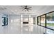 Bright living room with modern finishes, a built-in entertainment center, and expansive windows at 9201 Nightingale Rd, Weeki Wachee, FL 34613