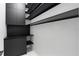 Hall storage with stylish shelves and under-stair organizers at 9201 Nightingale Rd, Weeki Wachee, FL 34613
