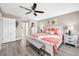 Comfortable bedroom with en-suite bathroom, ceiling fan, and neutral décor at 1009 Almondwood Dr, Trinity, FL 34655
