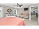 Relaxing bedroom features a sitting area, ceiling fan, and neutral color scheme at 1009 Almondwood Dr, Trinity, FL 34655