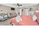 Spacious primary bedroom with a sitting area, TV, and en-suite bathroom at 1009 Almondwood Dr, Trinity, FL 34655