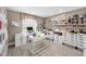 Bright craft room with built-in cabinets, desks, and storage, perfect for hobbies and creative projects at 1009 Almondwood Dr, Trinity, FL 34655