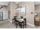 Elegant dining area with modern decor and open layout to the kitchen at 1009 Almondwood Dr, Trinity, FL 34655