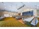 Bright community event space with a stage, lighting, and seating for many people at 1009 Almondwood Dr, Trinity, FL 34655