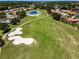 Expansive golf course view showcasing lush greens, sand traps and a pond in a residential community at 1009 Almondwood Dr, Trinity, FL 34655