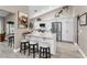 Modern kitchen with stainless steel appliances, sleek countertops, and ample seating at the island at 1009 Almondwood Dr, Trinity, FL 34655