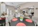 Modern open-concept kitchen and dining area with sleek countertops and seamless access to the living room at 1009 Almondwood Dr, Trinity, FL 34655