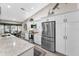 Well-lit kitchen with stainless steel appliances, white cabinetry, and ample countertop space at 1009 Almondwood Dr, Trinity, FL 34655
