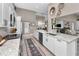 Contemporary kitchen featuring granite countertops, white cabinetry, and stainless steel appliances at 1009 Almondwood Dr, Trinity, FL 34655