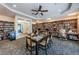 Inviting library with a study table, computer workstations, and many books at 1009 Almondwood Dr, Trinity, FL 34655