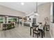Bright, open living space featuring modern furnishings and easy access to the outdoor patio and kitchen at 1009 Almondwood Dr, Trinity, FL 34655