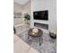 Close up of cozy living room showcasing the fireplace feature wall with a modern electric fireplace and mounted TV at 1009 Almondwood Dr, Trinity, FL 34655