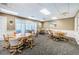 The common space is perfect for community meetings with comfortable seating and neutral decor at 1009 Almondwood Dr, Trinity, FL 34655