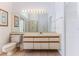 Full bathroom features tile flooring, toilet, shower, and double sink vanity with ample storage at 10285 Rosetti Ct, Spring Hill, FL 34608