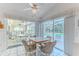Breakfast nook with tile flooring and views of the enclosed pool area at 10285 Rosetti Ct, Spring Hill, FL 34608