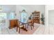 Bright dining room with large window views; the perfect place to enjoy your next meal at 10285 Rosetti Ct, Spring Hill, FL 34608