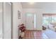 Bright foyer with tile flooring, closet, and front door, leading into the living area at 10285 Rosetti Ct, Spring Hill, FL 34608