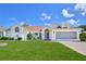 Charming single-story home with a well-manicured lawn and a two-car garage at 10285 Rosetti Ct, Spring Hill, FL 34608