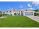 Charming single-story home with a well-manicured lawn and a two-car garage at 10285 Rosetti Ct, Spring Hill, FL 34608