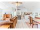 Bright, open floor plan featuring living room, dining area, and kitchen, enhancing the home's spacious feel at 10285 Rosetti Ct, Spring Hill, FL 34608