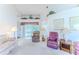 Comfortable living room with plush seating, carpeted floors, and view to the backyard patio at 10285 Rosetti Ct, Spring Hill, FL 34608