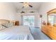 Bright main bedroom with furniture and ensuite bathroom at 10285 Rosetti Ct, Spring Hill, FL 34608