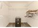 Spacious walk-in closet featuring wire shelving and a dark grey carpeted floor at 10285 Rosetti Ct, Spring Hill, FL 34608