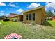 Spacious backyard showing yard size and some exterior home features at 11101 Ragsdale Ct, New Port Richey, FL 34654
