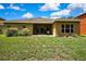 Private backyard with a covered patio, perfect for outdoor dining and relaxation at 11101 Ragsdale Ct, New Port Richey, FL 34654