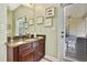 Bathroom vanity with granite countertop and access to outdoor patio with dining set at 11101 Ragsdale Ct, New Port Richey, FL 34654