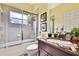 Bathroom featuring a bathtub and shower combination with a glass enclosure and granite countertop at 11101 Ragsdale Ct, New Port Richey, FL 34654
