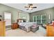 Calming bedroom with natural light, neutral tones, and a cozy seating area at 11101 Ragsdale Ct, New Port Richey, FL 34654