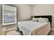 Cozy bedroom with a comfortable bed and window providing natural light, creating a relaxing atmosphere at 11101 Ragsdale Ct, New Port Richey, FL 34654