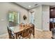 Casual dining area featuring a wooden table, comfortable seating, and lots of natural light at 11101 Ragsdale Ct, New Port Richey, FL 34654