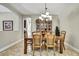 Formal dining room with decorative lighting and classic wood furnishings, perfect for gatherings at 11101 Ragsdale Ct, New Port Richey, FL 34654